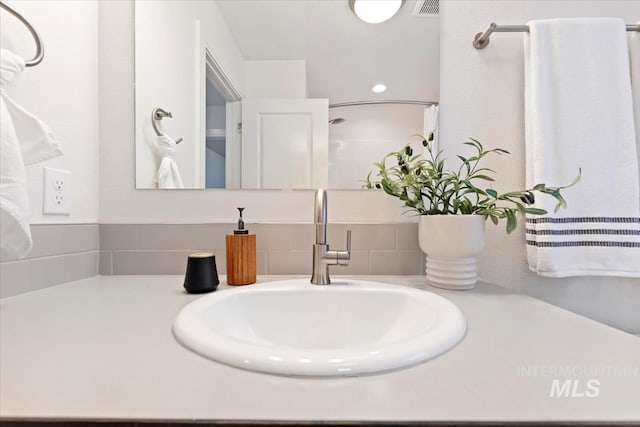 bathroom with vanity and visible vents