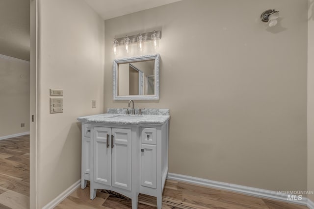 bathroom featuring hardwood / wood-style floors and vanity