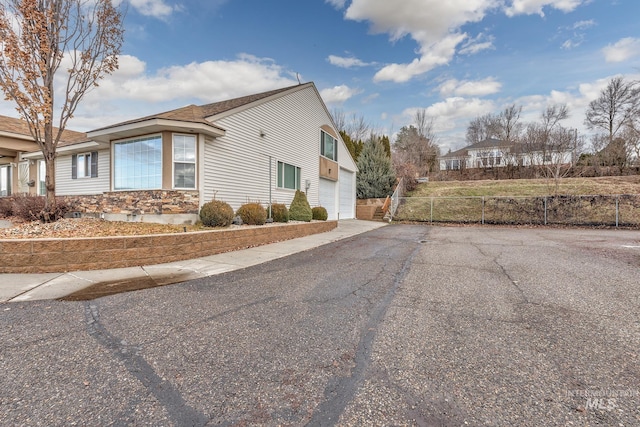 view of property exterior featuring a garage