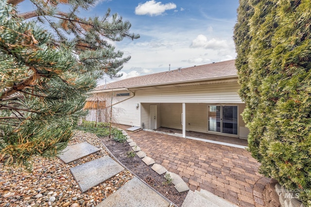 rear view of property featuring a patio area