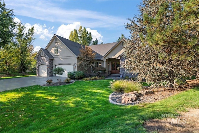 view of front of home featuring a garage and a front lawn