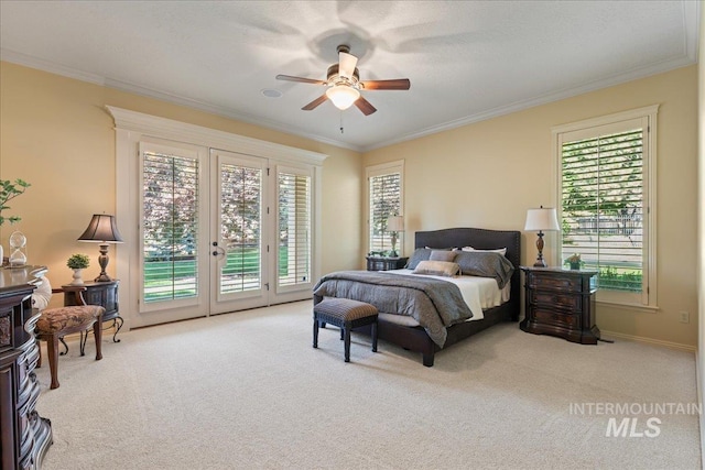 carpeted bedroom with ornamental molding, ceiling fan, and access to exterior