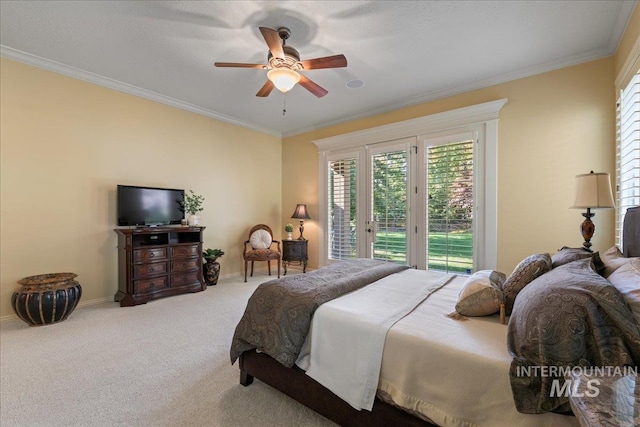 carpeted bedroom featuring crown molding, access to outside, and ceiling fan