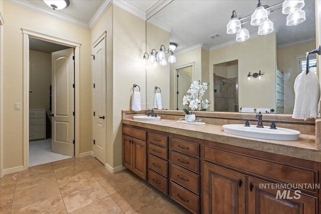 bathroom with an enclosed shower, vanity, and crown molding