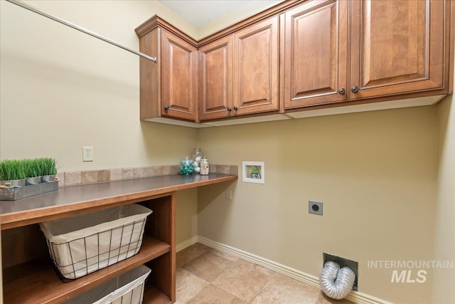 laundry room with hookup for a washing machine, cabinets, and hookup for an electric dryer