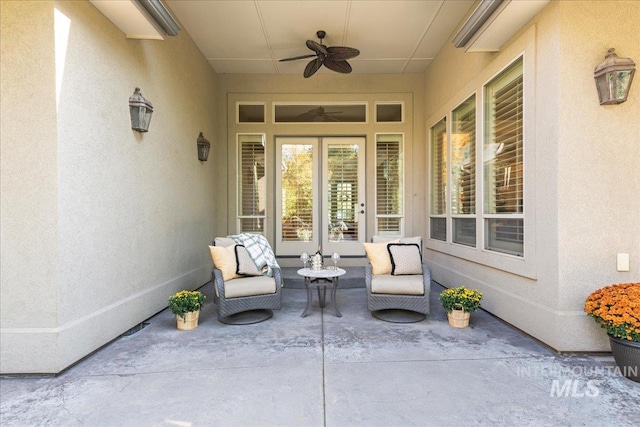 view of patio with an outdoor living space and ceiling fan