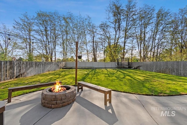 view of patio / terrace featuring a fenced backyard and an outdoor fire pit