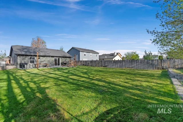 view of yard featuring a fenced backyard and a patio