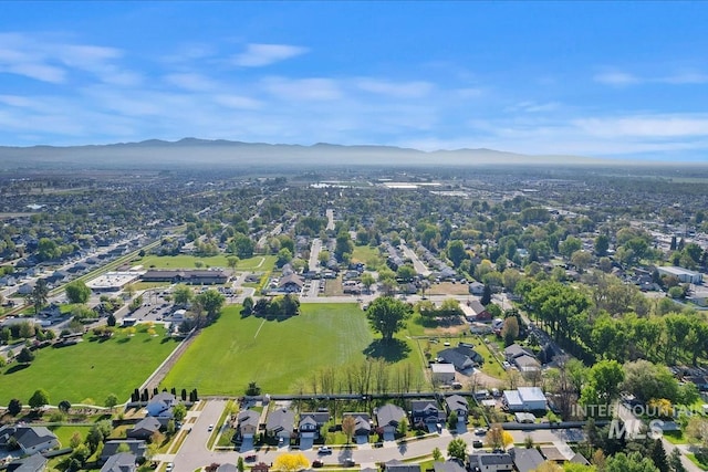 birds eye view of property featuring a mountain view and a residential view