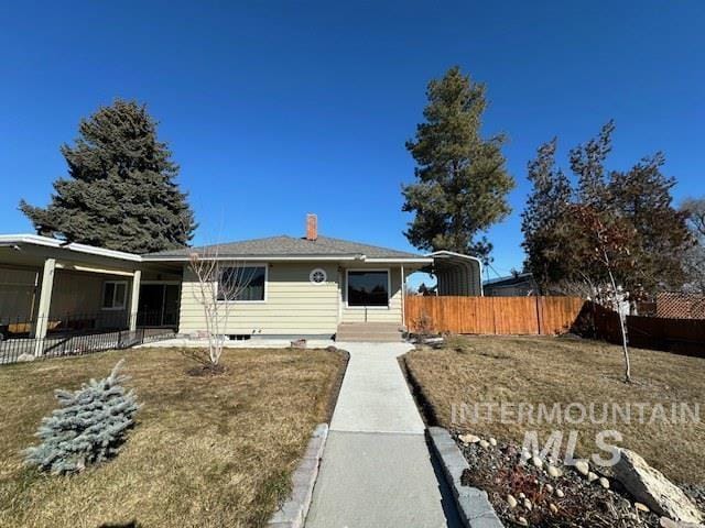 view of front of house with fence