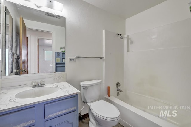 full bathroom featuring vanity, shower / bath combination, and toilet