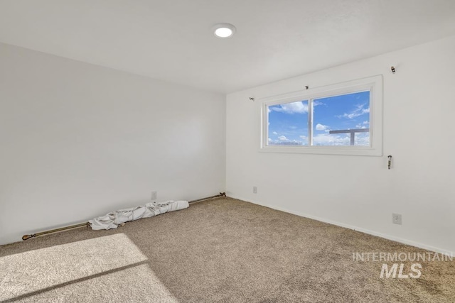 view of carpeted spare room