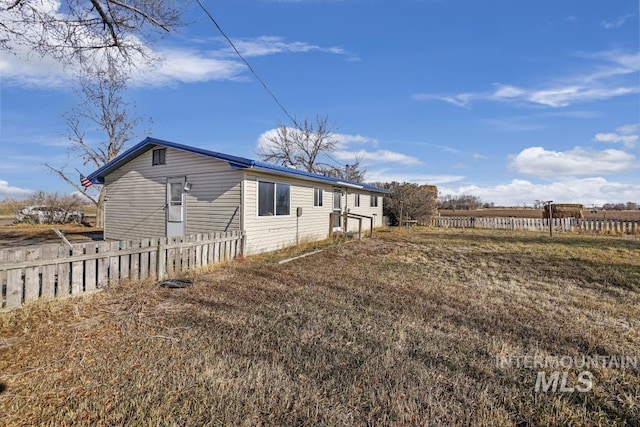 view of side of property with a rural view