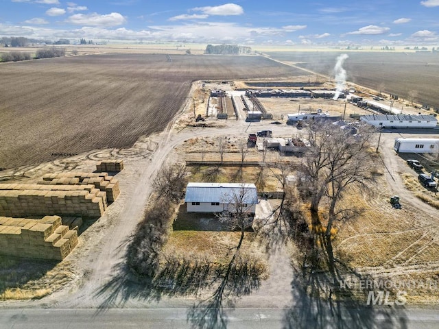 birds eye view of property with a rural view