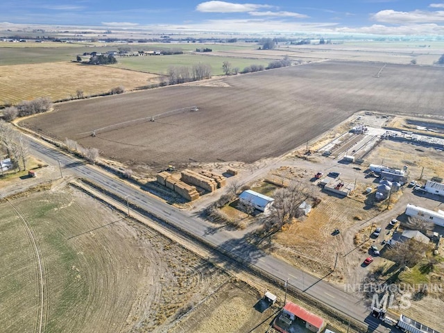 birds eye view of property featuring a rural view