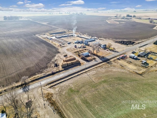 birds eye view of property with a rural view