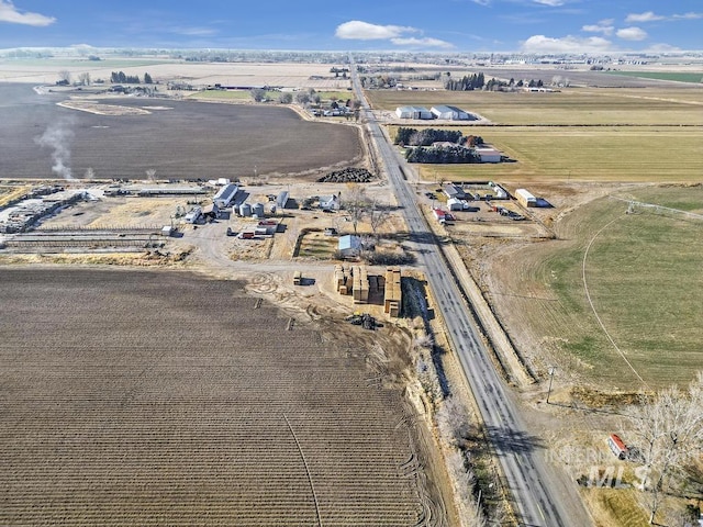 birds eye view of property with a rural view