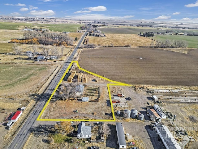 birds eye view of property featuring a rural view