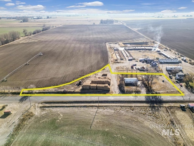 birds eye view of property featuring a rural view