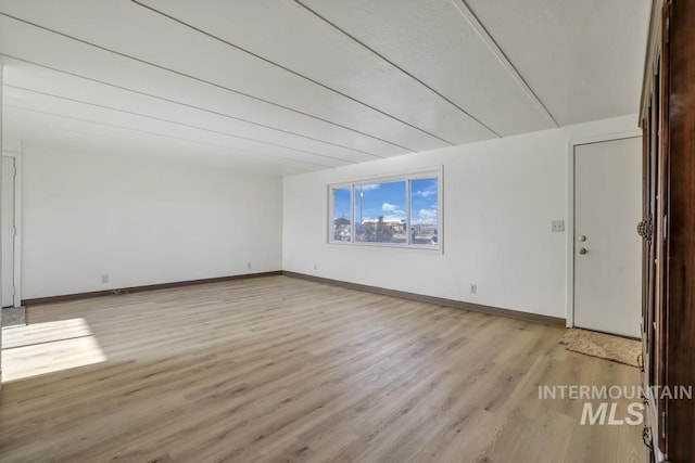 spare room featuring light wood-type flooring