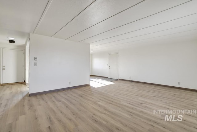 spare room featuring light hardwood / wood-style floors