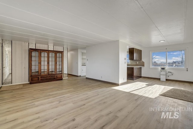 unfurnished living room with light hardwood / wood-style floors