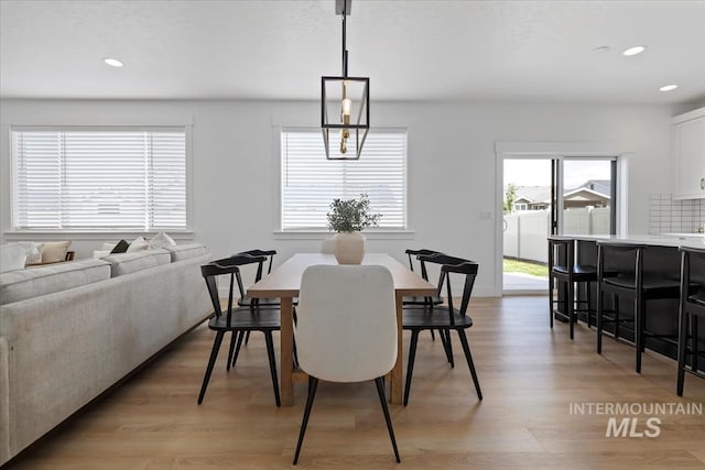 dining space featuring light wood-style floors and recessed lighting