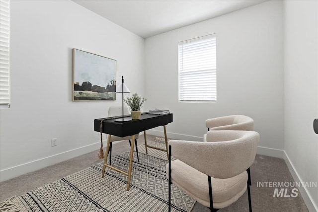 carpeted home office featuring baseboards