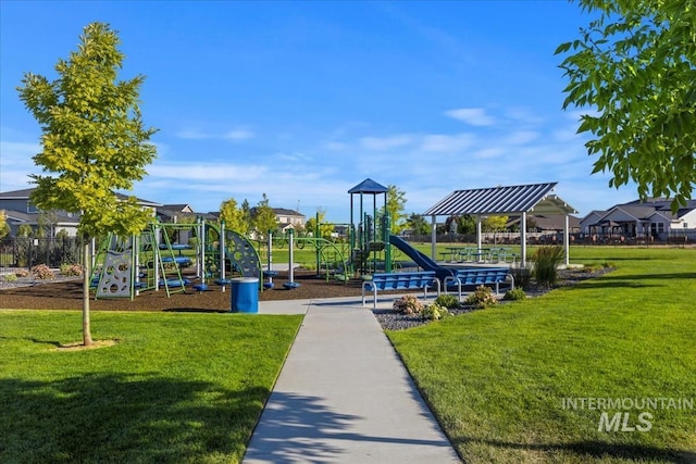 community jungle gym featuring a yard