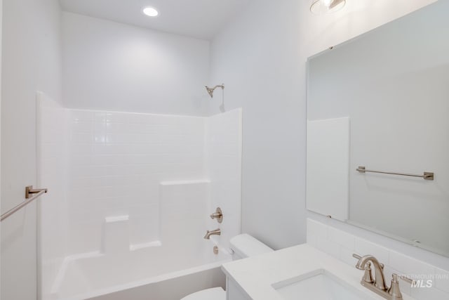 full bathroom featuring vanity, toilet, and bathtub / shower combination