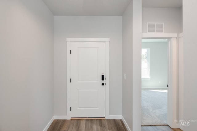 interior space with hardwood / wood-style flooring