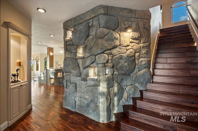 9105 W Mcmillan, Nampa, ID 83687 - stairs with wood-type flooring and arched walkways