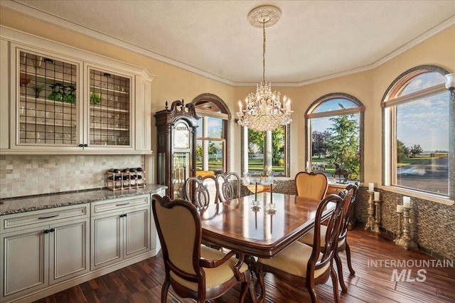 9105 W Mcmillan, Nampa, ID 83687 - dining room with a chandelier, dark wood-style flooring, and crown molding