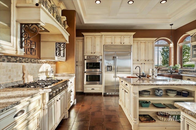 9105 W Mcmillan, Nampa, ID 83687 - kitchen with cream cabinets, appliances with stainless steel finishes, light stone countertops, recessed lighting, and backsplash