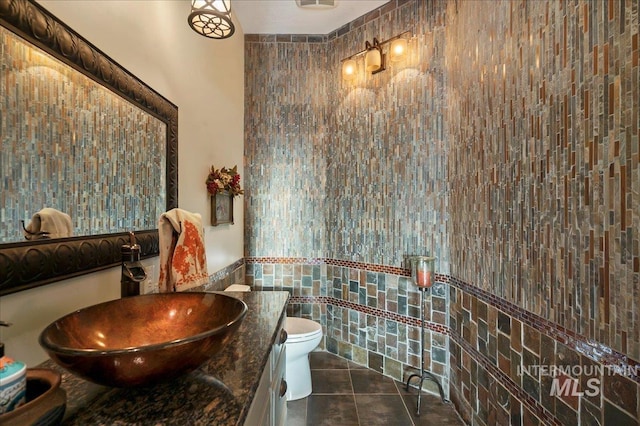 9105 W Mcmillan, Nampa, ID 83687 - bathroom with tile walls, tile patterned flooring, toilet, and vanity