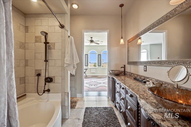 9105 W Mcmillan, Nampa, ID 83687 - full bathroom with double vanity, plenty of natural light, shower / bathtub combination with curtain, and tile patterned floors