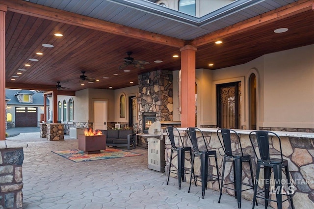 9105 W Mcmillan, Nampa, ID 83687 - view of patio / terrace with a bar, a fire pit, and ceiling fan