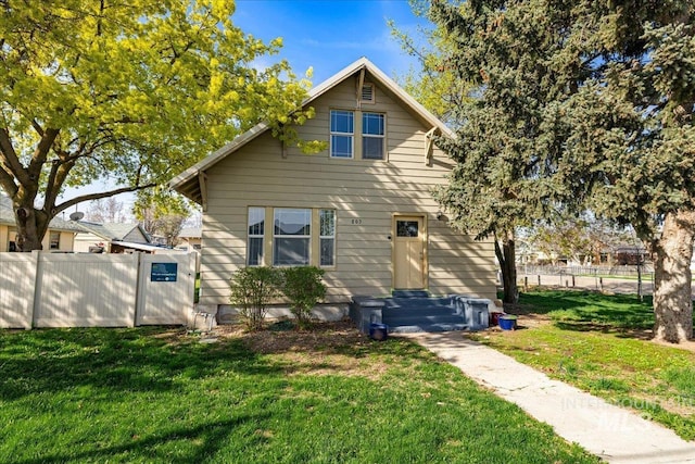 803 4th St S, Nampa, ID 83651 - rear view of house with a yard and fence