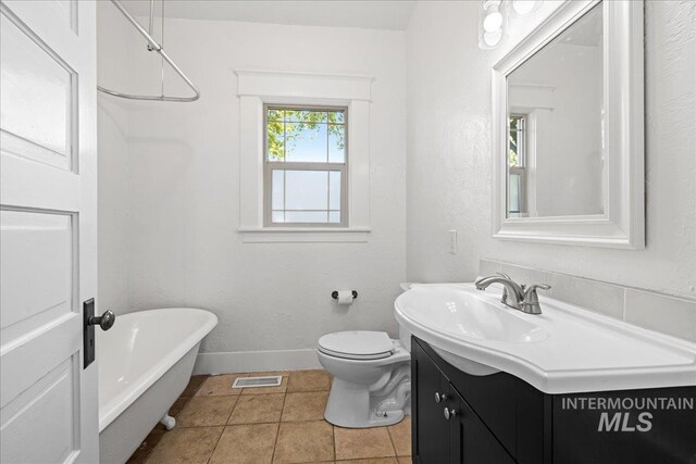 803 4th St S, Nampa, ID 83651 - full bathroom featuring vanity, a soaking tub, tile patterned floors, toilet, and visible vents