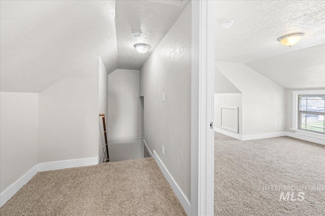 803 4th St S, Nampa, ID 83651 - bonus room featuring a textured ceiling, carpet, and vaulted ceiling