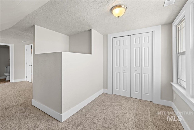 803 4th St S, Nampa, ID 83651 - interior space featuring a closet, visible vents, a textured ceiling, and carpet floors