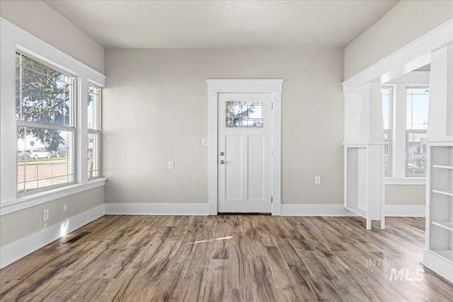 803 4th St S, Nampa, ID 83651 - entryway with visible vents, baseboards, plenty of natural light, and wood finished floors