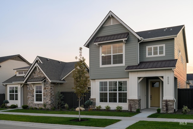 craftsman house featuring a yard