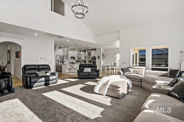 2873 W Wind Dr, Eagle, ID 83616 - carpeted living room featuring a chandelier and high vaulted ceiling