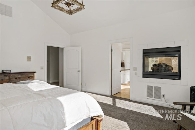 2873 W Wind Dr, Eagle, ID 83616 - carpeted bedroom with a multi sided fireplace, high vaulted ceiling, and ensuite bath