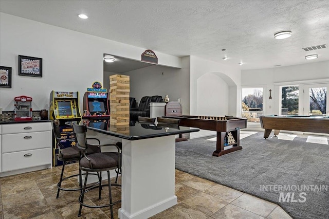 2873 W Wind Dr, Eagle, ID 83616 - playroom featuring light colored carpet, billiards, and a textured ceiling