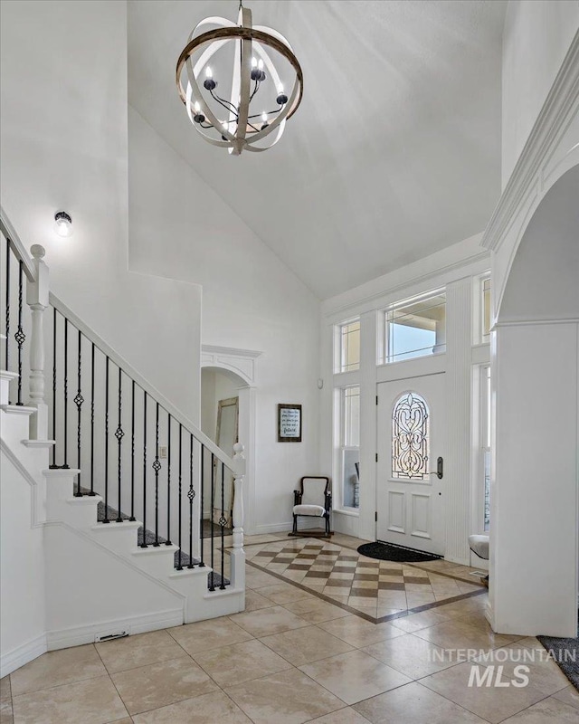 2873 W Wind Dr, Eagle, ID 83616 - entrance foyer featuring a towering ceiling, light tile patterned floors, and a notable chandelier