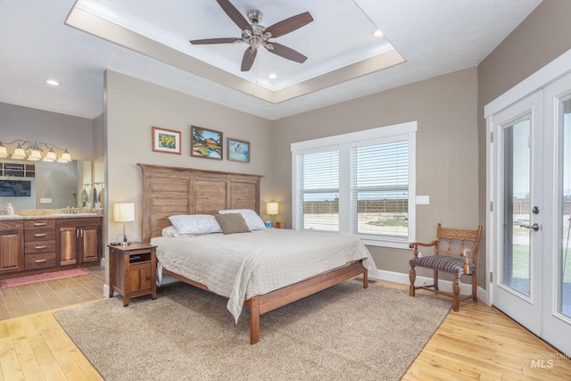120 S Marko Ln, Kuna, ID 83634 - bedroom with a raised ceiling, light wood-style floors, access to outside, ensuite bathroom, and ornamental molding
