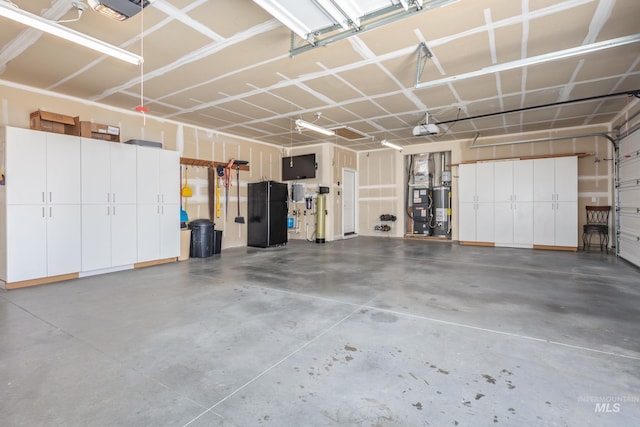120 S Marko Ln, Kuna, ID 83634 - garage with a garage door opener and water heater