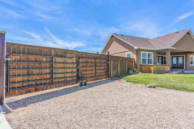 120 S Marko Ln, Kuna, ID 83634 - view of side of property featuring french doors, stucco siding, and a shingled roof